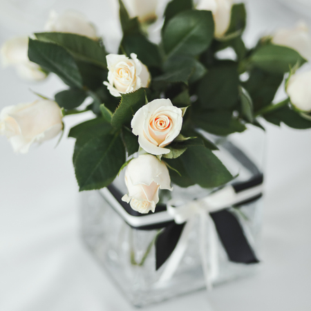 Wedding table with white roses in vase.の写真素材