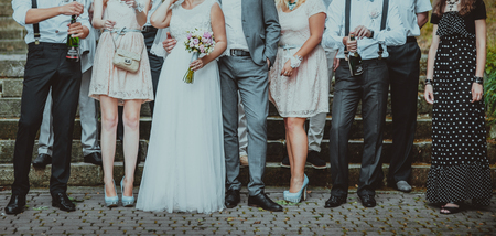 Wedding couple posing with guests. Summer newlyweds photo.の写真素材