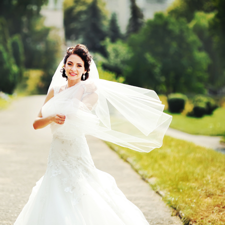 Outdoor summer portrait of young   brunette brideの写真素材