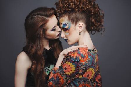 Glamorous ladies. Sensual young women with artistic make-up.の写真素材