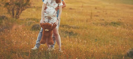 Young couple in summer field. Romantic moments of our lives.の写真素材