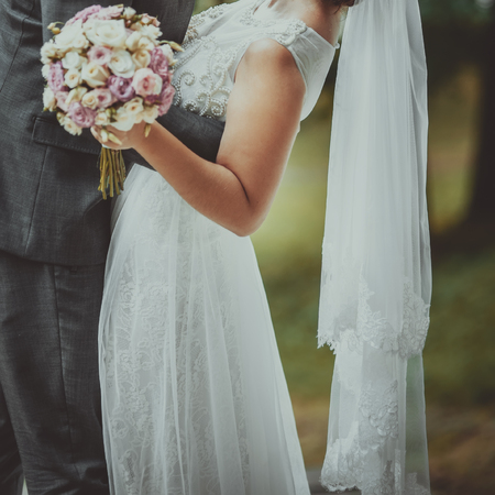 Happy bride and groom together. Summer wedding photo.の写真素材