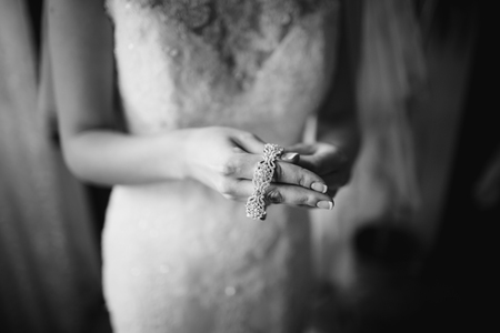 Happy bridal morning. Fiance getting ready. Wedding picture in black and white.の写真素材