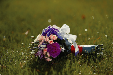 Beautiful wedding bouquet on the grassの写真素材