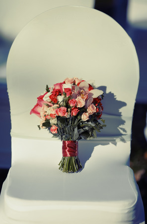 Wedding  bouquet of various flowers on chair.の写真素材