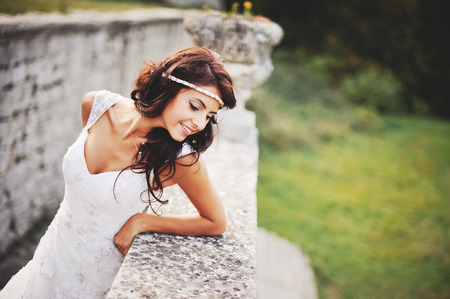 Wedding picture of happy brunette bride outside.の写真素材