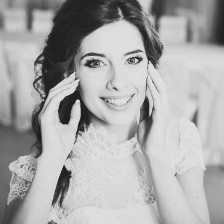Happy bride posing. Wedding portrait of beautiful fiance in black and white.の写真素材