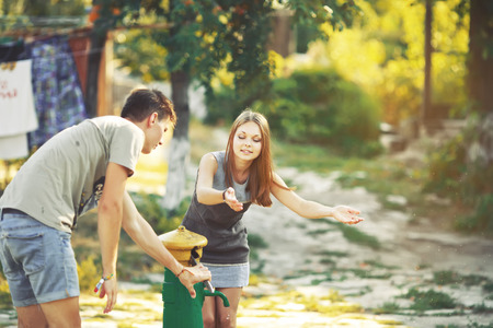 Teenage girl having fun outside. Young couple together.の写真素材