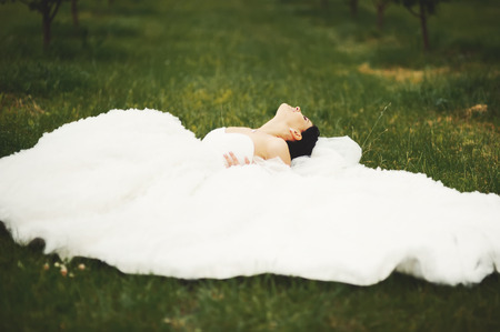 Gorgeous  young bride enjoying wedding day. Summertime newlywed.の写真素材