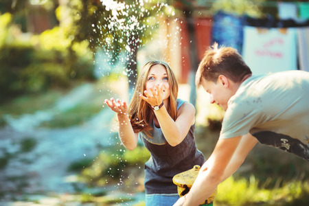 Teenage girl having fun outside. Young couple together.の写真素材