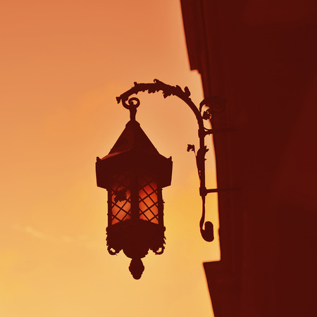 Vintage  street lamp on wall in west Ukraineの写真素材