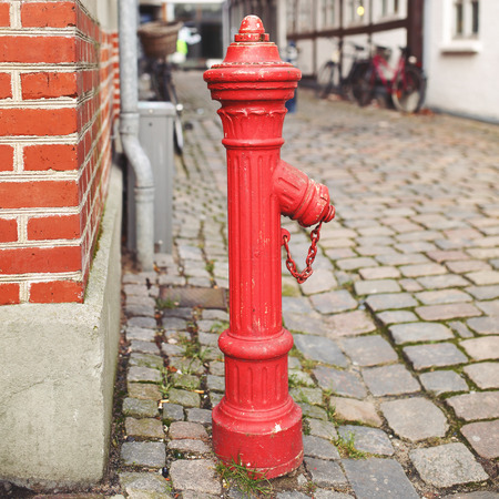 Red fire hydrant. Sidewalk.の写真素材
