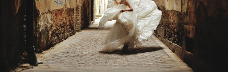 Young bride having fun with her dressの写真素材