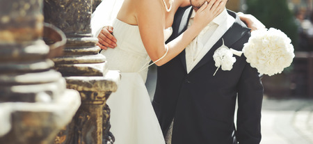 Happy wedding couple together downtown.の写真素材