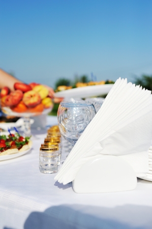 snacks and drinks on wedding table outsideの写真素材