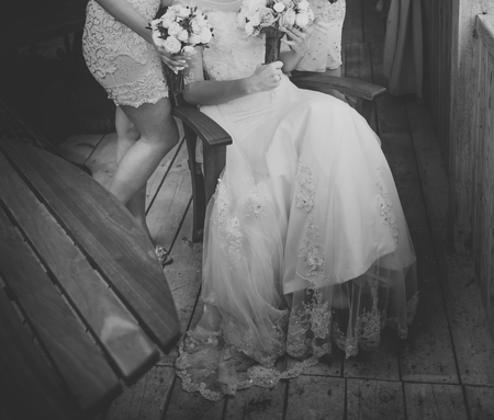 Bride and bridesmaids holding bouquets, posingの写真素材