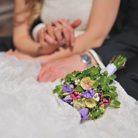 Hands of groom and bride. Wedding rings.の写真素材