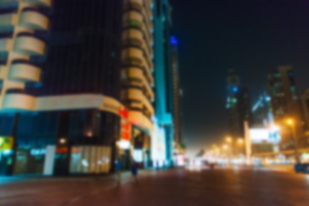 Blurred image of night street view of Dubai, UAE. Beautiful skyscrapers. Dubai downtown skyline.の写真素材