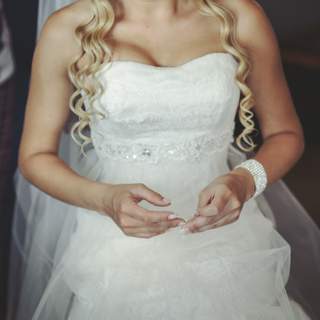 Bride getting ready in the morning at home. の写真素材