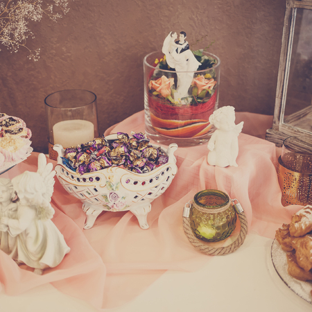 Sweet desserts with cream, berries and pastry on wedding banquet table.の写真素材