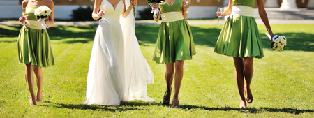 bride with bridesmaids around, happy wedding dayの写真素材
