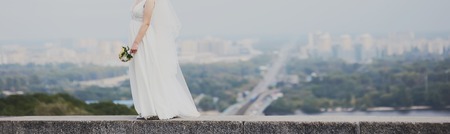 young bride walking street, wedding photographyの写真素材