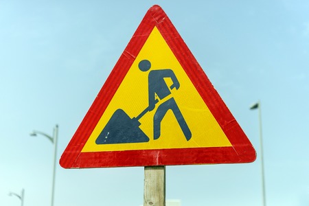 Road sign man at work, road under constractionの写真素材