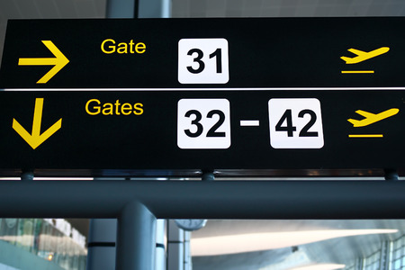 gate directional sign at airportの写真素材