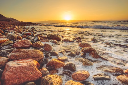 Sunrise over Saudi Arabia from Egypt side, Aqaba gulfの写真素材