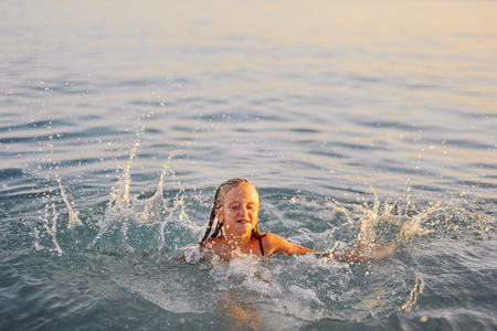 happy kid swimming, having fun in Red Sea, Egyptの写真素材