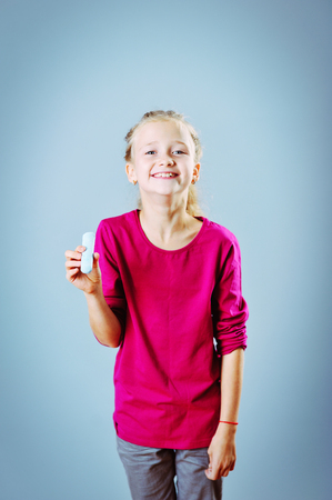 young girl having a chalk in her handの写真素材
