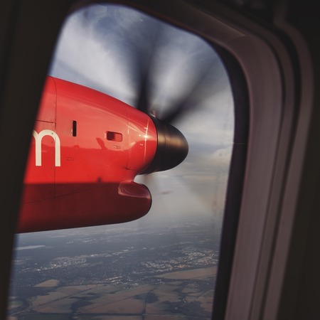 looking through window of an airplaneの写真素材