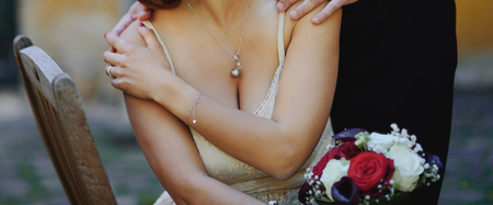 Happy wedding, bride and groom together holding handsの写真素材