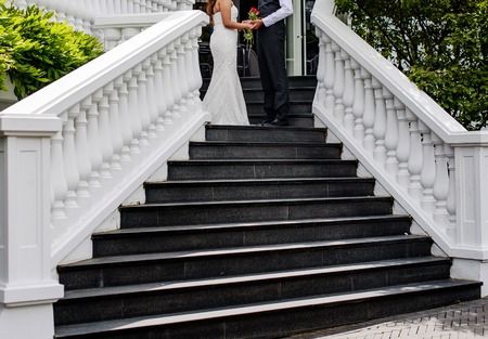asian bridal couple embracing, happy wedding, bride and groom togetherの写真素材