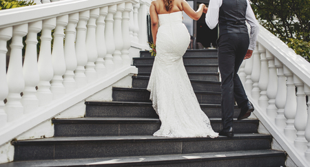 asian bridal couple embracing, happy wedding, bride and groom togetherの写真素材