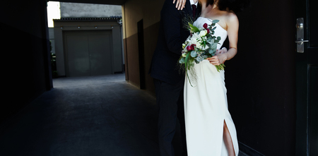 Young married couple together walking around the cityの写真素材