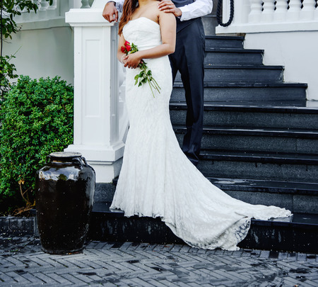 lovely bridal couple embracing, happy wedding, bride and groom togetherの写真素材