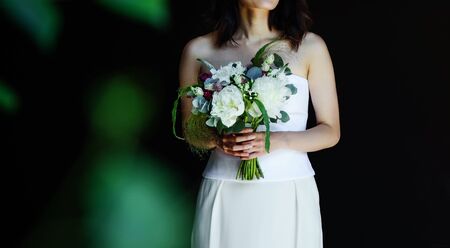 Wedding photo of an elegant bride with a bridal bouquet.の写真素材