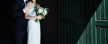 Just married bridal couple walking around Copenhagen, happy bride and groom together.の写真素材