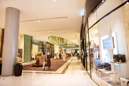 Dubai, UAE - May 31, 2013. People walking around in The Dubai Mall is the largest mall in the world...