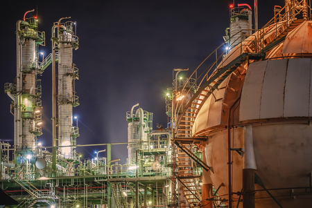 Oil refinery plant with night, Gas storage tank in petrochemical plant at night timeのeditorial素材