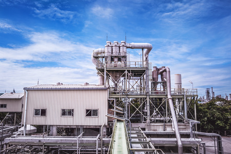 Manufacturing of petrochemical plant with blue sky background
