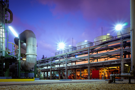 Factory of industrial plant at twilight time with pipeline and pipe rackの写真素材