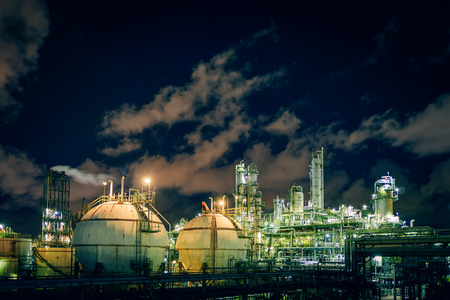 Glitter lighting of petrochemical plant at night, Manufacturing of petroleum plant, Products tank in...