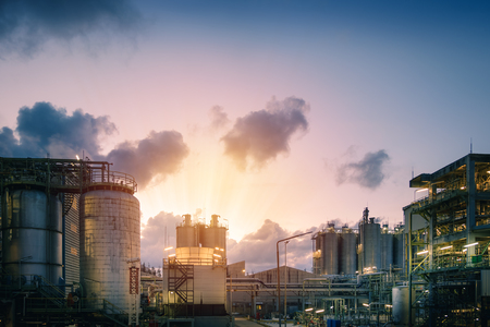 Manufacturing of petroleum industrial plant with sunset sky background, Petrochemical plant at eveningの写真素材