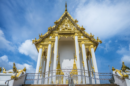 Temple of Buddhism on blue sky with white cloudの写真素材