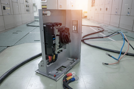 Electrical substation room in petrochemical industry or Oil and gas refinery and power plants, Switchgear or beaker with wire connect conceptの写真素材