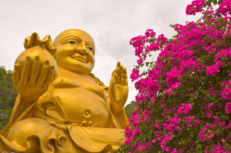Statue of Fat Buddha isolated on whiteの写真素材