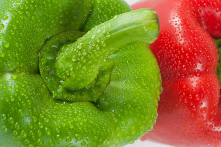 Green and Red Pimento Close-up with droplet of water