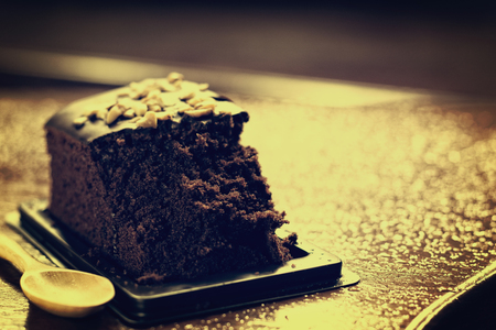 Chocolate cake is placed on the wood table.の写真素材